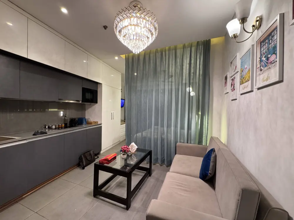 open kitchen and dining area at Mulberry Homes Supernova Noida