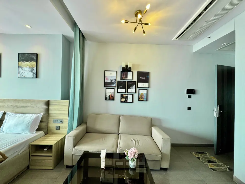 spacious bedroom with wall art in RiverEase 29 Mulberry Homes Noida