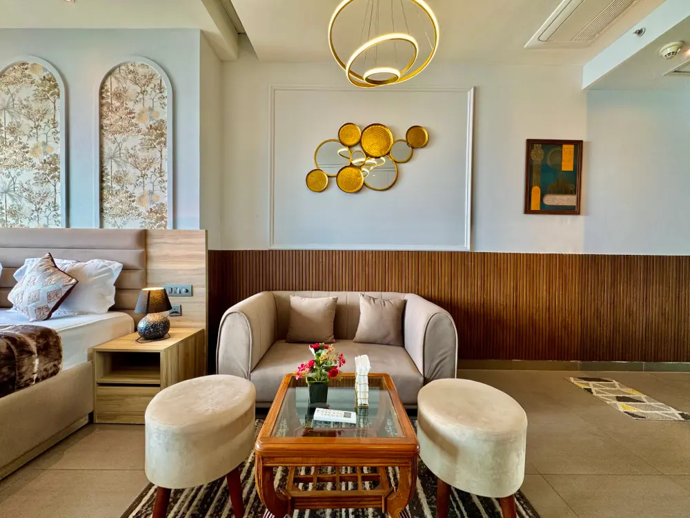 cozy living room with chandelier in Eleve 31 Mulberry Homes Noida