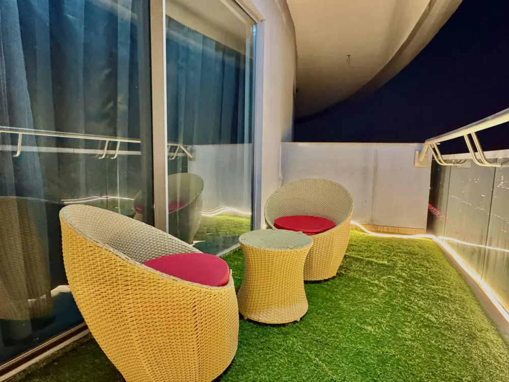 balcony outdoor seating with grass in Panorama 32 Supernova Noida