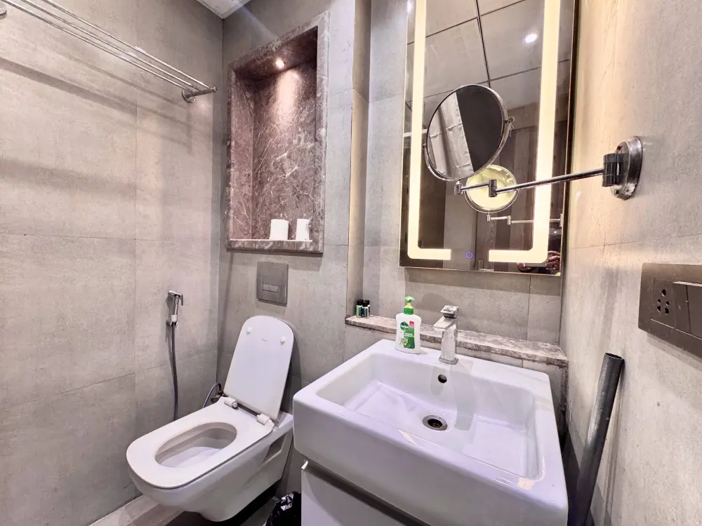 Luxury shower bathroom at Mulberry Homes private stay Noida