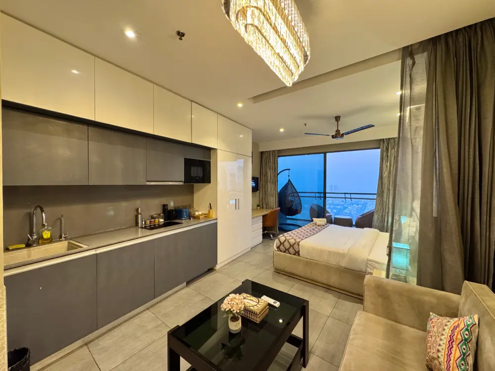 Modern bedroom with built-in wardrobe at Mulberry Homes Supernova Noida