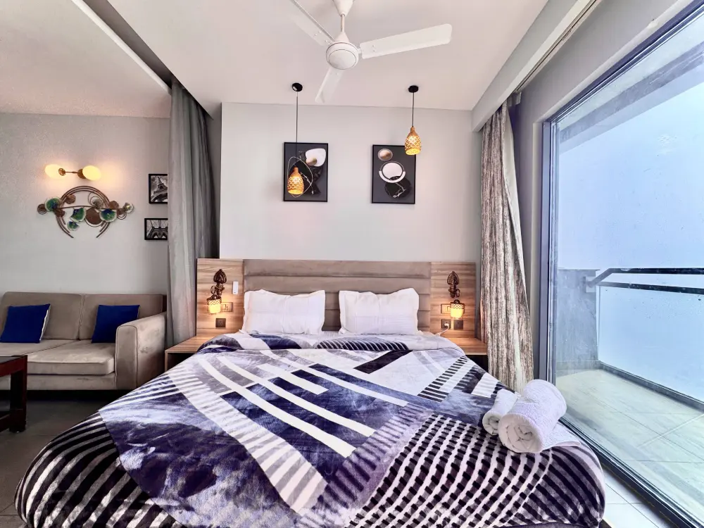 Luxury bedroom interior at Mulberry Homes private stay Noida