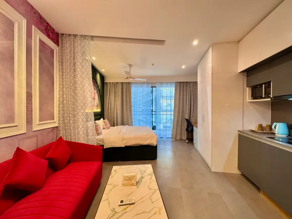 Modern kitchen and dining area at Supernova 94 Noida Airbnb