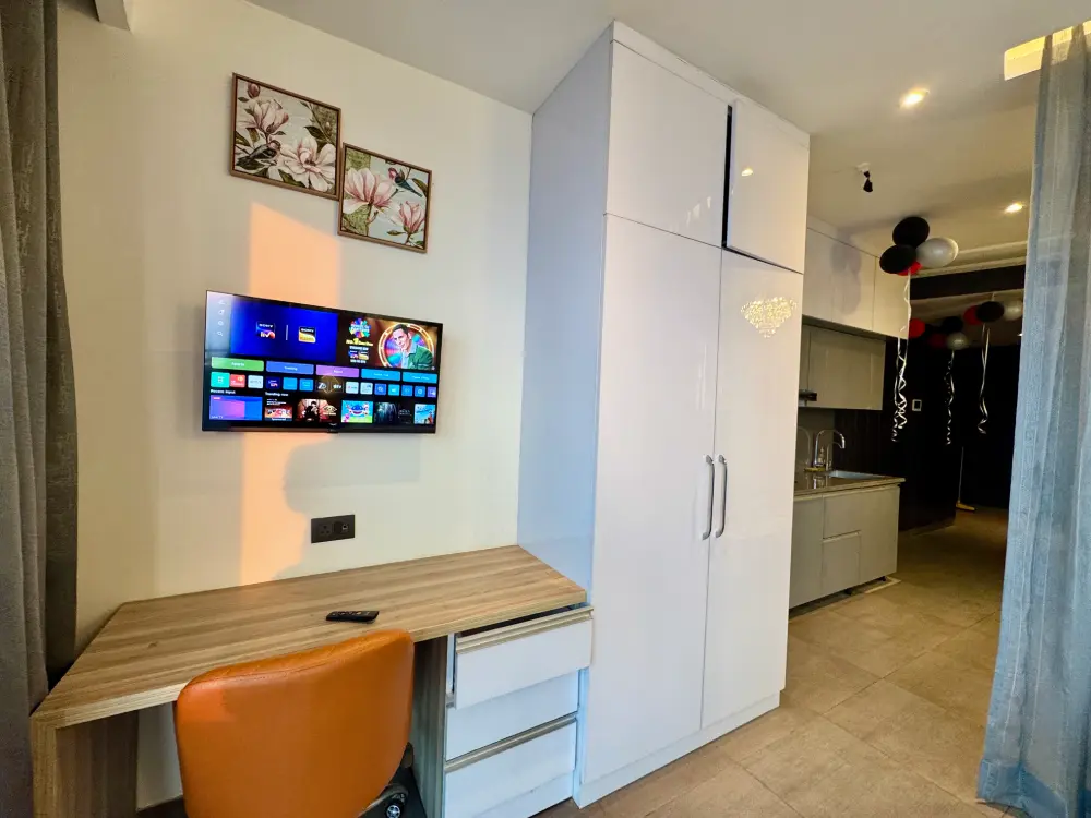 Panorama 32 bedroom with smart TV workspace Mulberry Homes Noida