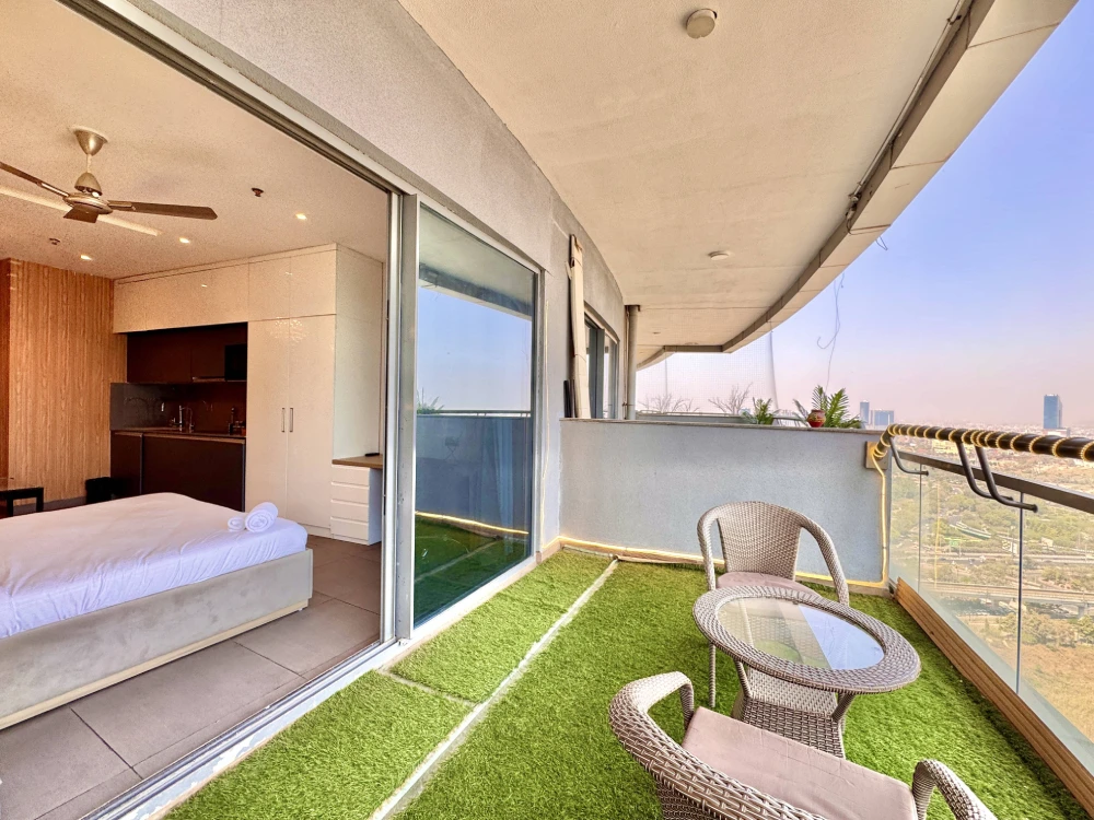 Supernova 94 Noida modern living room interior – Skyline Stay night view apartment