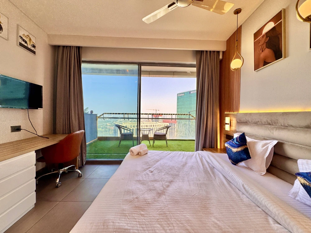 Suprnova Noida furnished apartment bedroom – Skyline Stay Sector 94 Airbnb