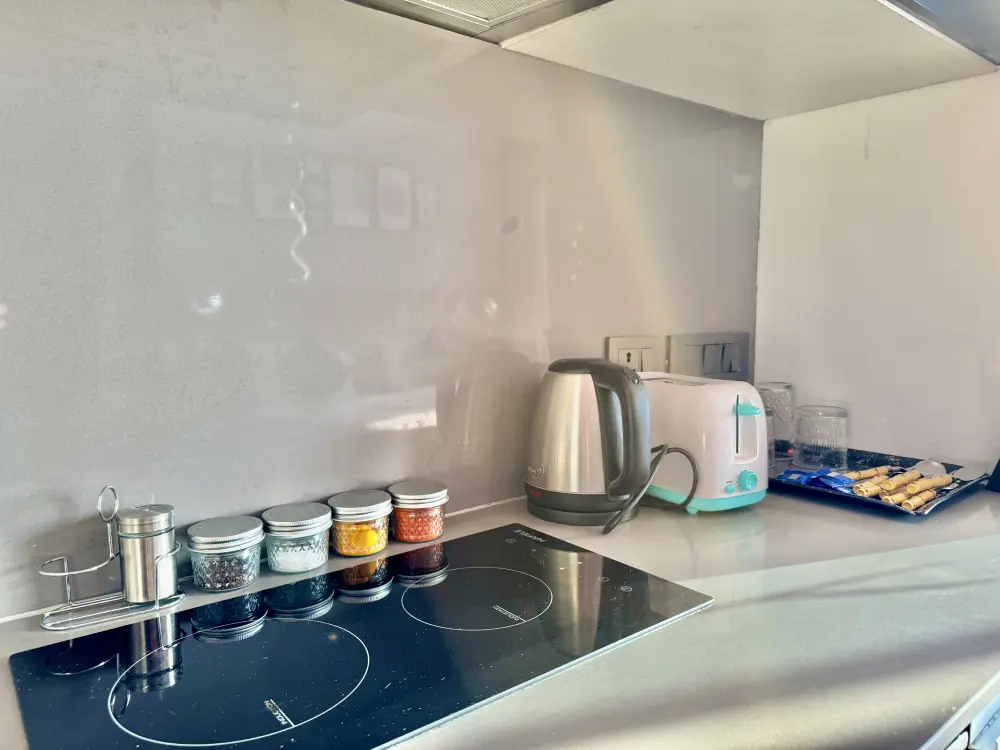 Fully equipped kitchen at SkyRiver 43 river view apartment Noida