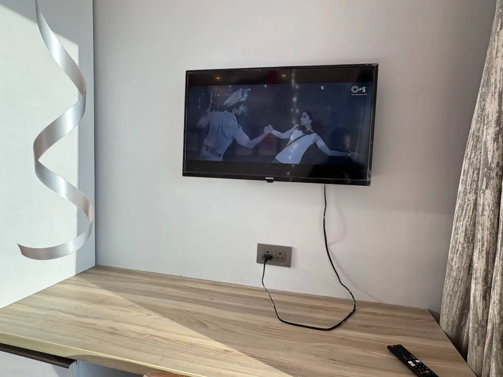 TV lounge and seating area inside SkyRiver 43 Supernova Noida apartment