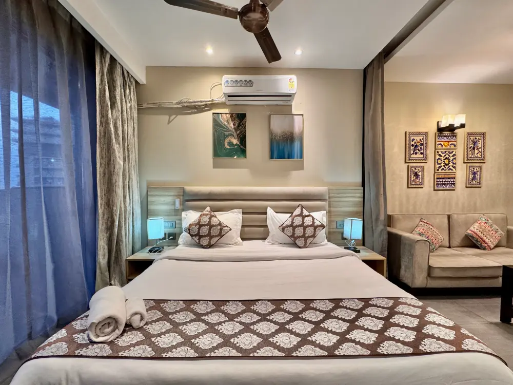 Bedroom with balcony view at Mulberry Homes Supernova Noida