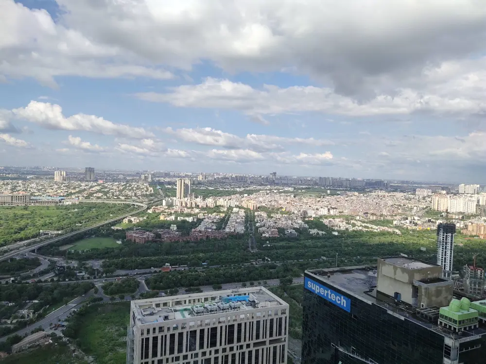 Aerial city skyline view of Supernova 94 Noida Airbnb Spira location